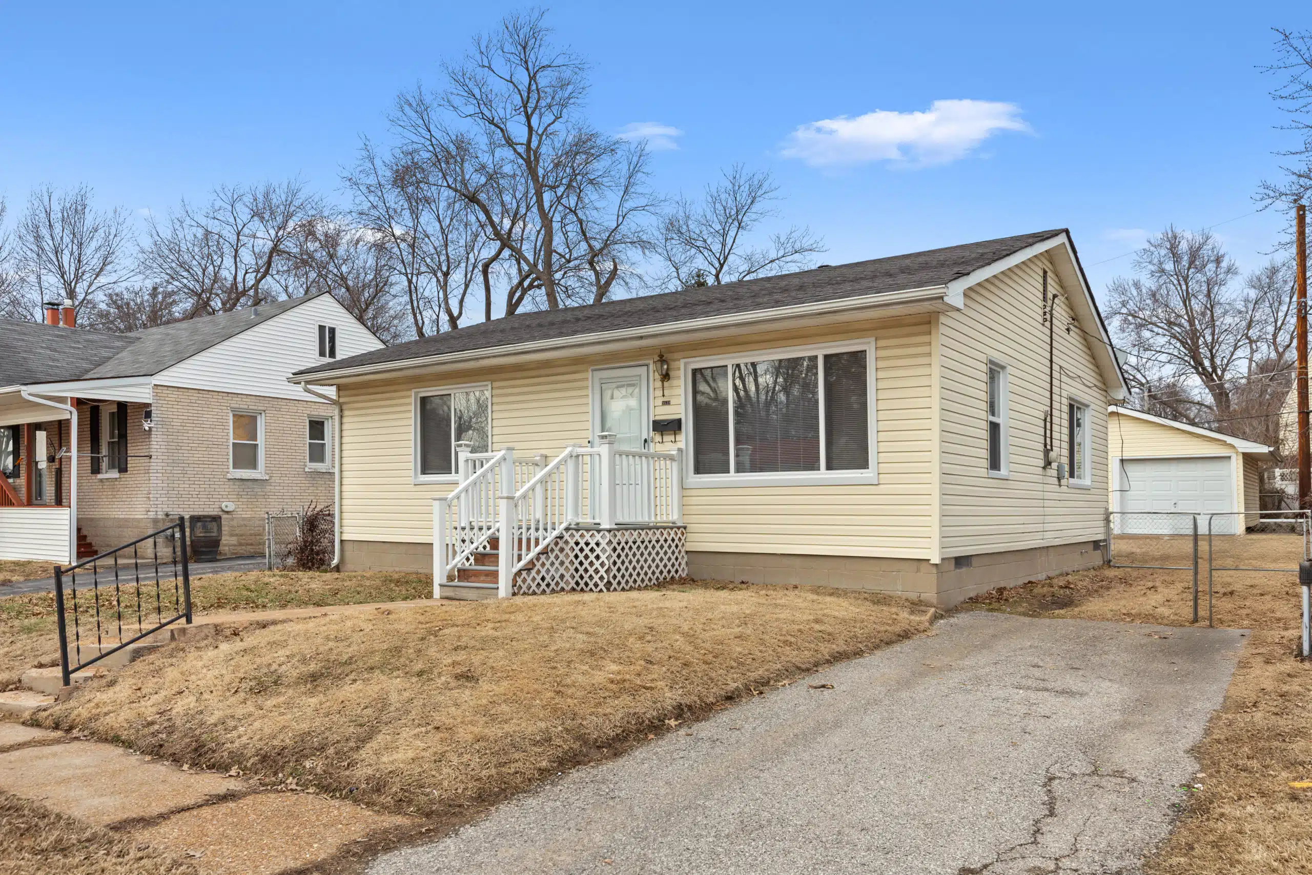 A yellow home in St. Louis that was sold as is for cash