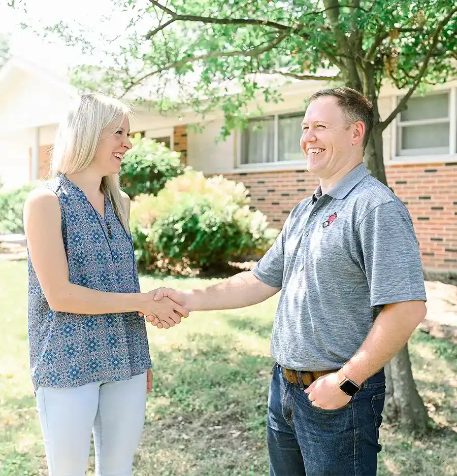 Lane and a client shaking hands