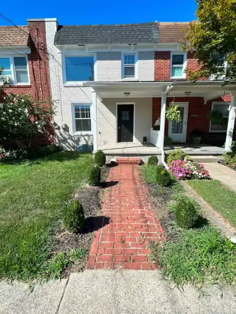 The front of a white row home in St. Louis