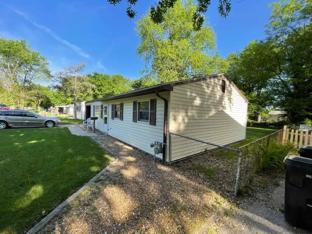 The front of a home in St. Louis with a fence