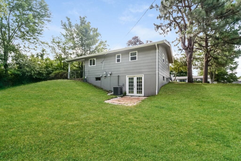The back of a grey house in St. Louis that still had a mortgage
