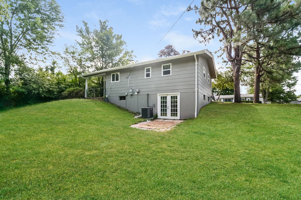 The back of a grey house in St. Louis that still had a mortgage